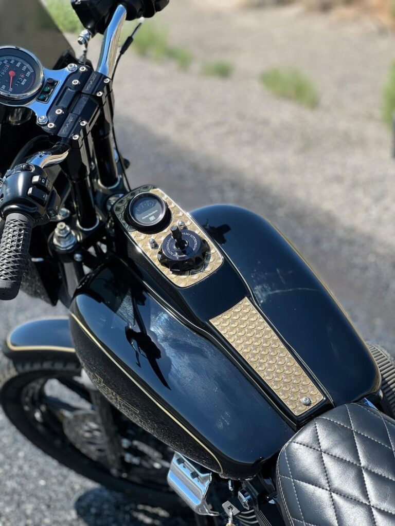 FXR with brass fish scale tank dash cover